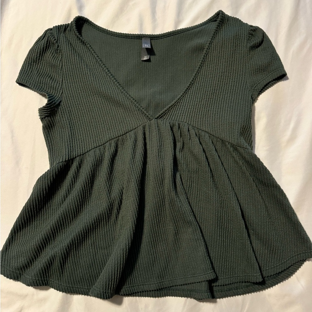 Francesca’s green blouse
